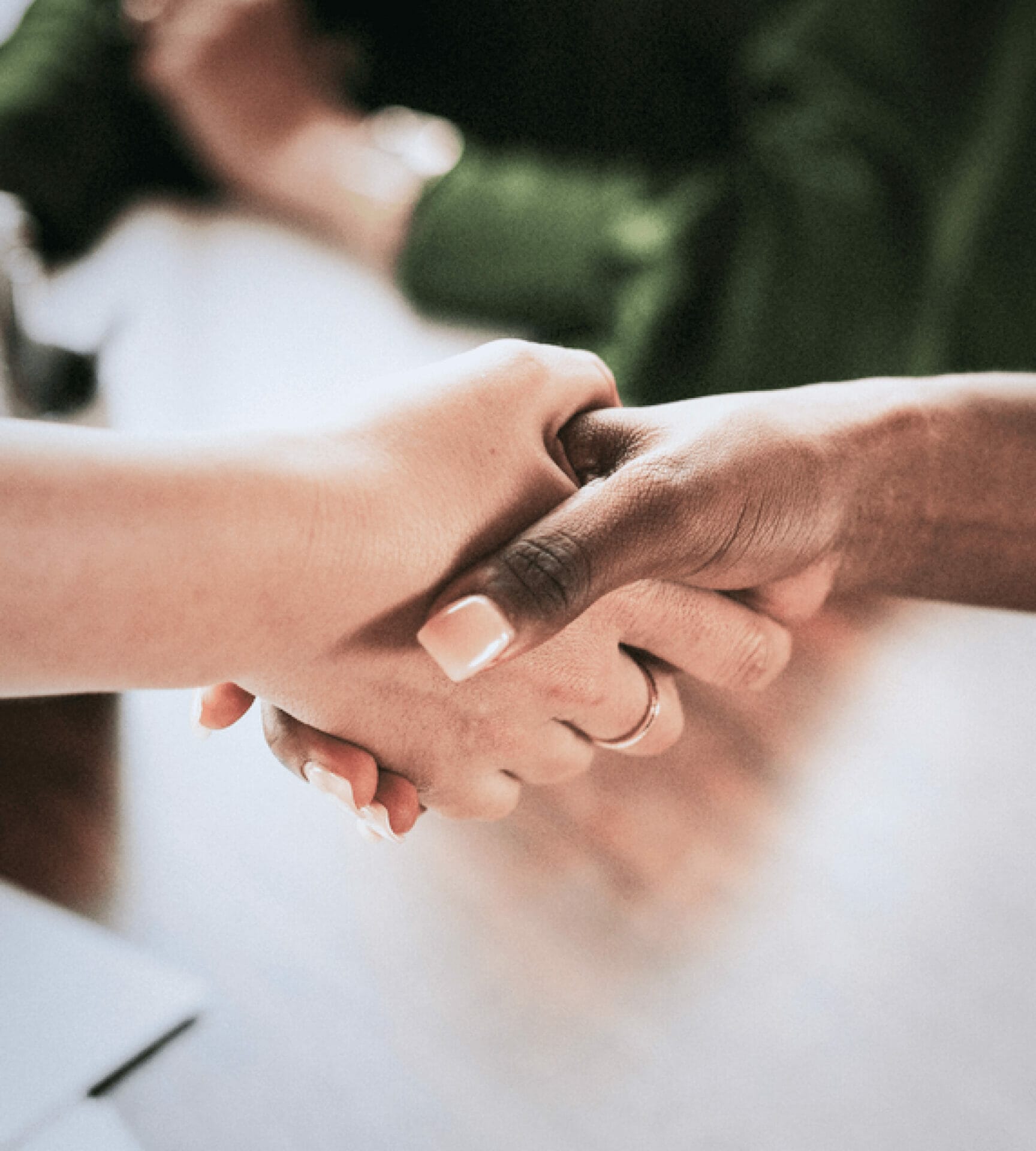 Image of people shaking hands for a blog about how partnerships drive healthcare CX innovation
